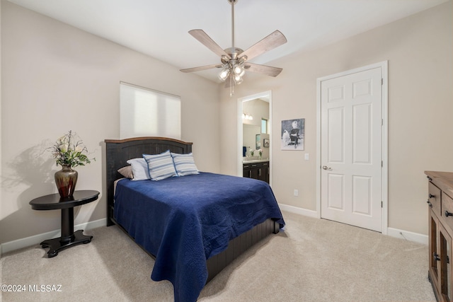 carpeted bedroom with connected bathroom and ceiling fan