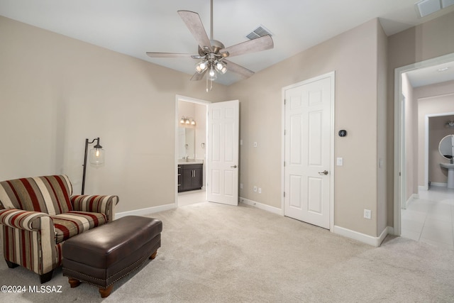 sitting room featuring ceiling fan and light carpet