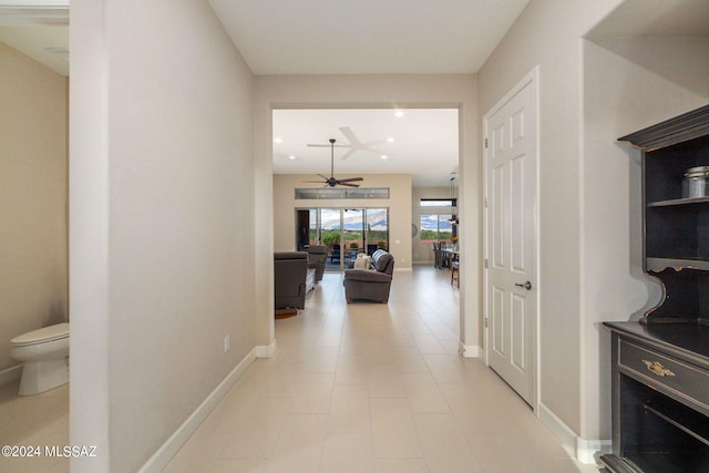 hallway featuring light tile patterned floors