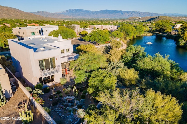 drone / aerial view with a water and mountain view