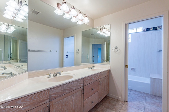 bathroom featuring a notable chandelier, vanity, tile patterned flooring, and separate shower and tub