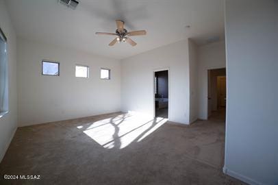 carpeted empty room with ceiling fan