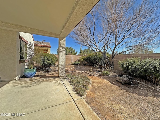 view of yard featuring a patio area and a fenced backyard