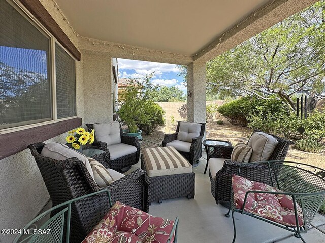 exterior space featuring outdoor dining area, a patio, and stucco siding