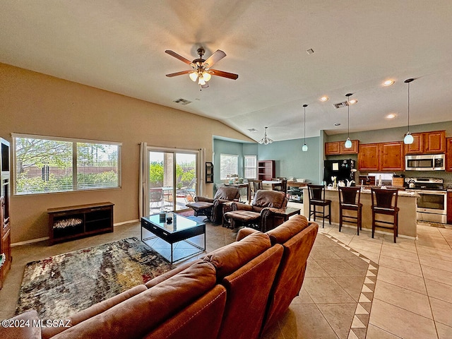 tiled living room with vaulted ceiling and ceiling fan