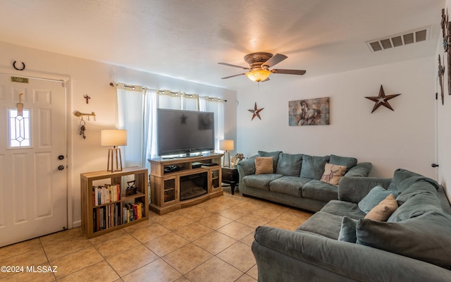 living room featuring ceiling fan, a healthy amount of sunlight, and light tile patterned flooring