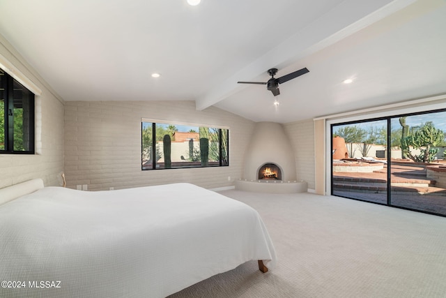 bedroom with ceiling fan, a fireplace, access to outside, lofted ceiling with beams, and brick wall