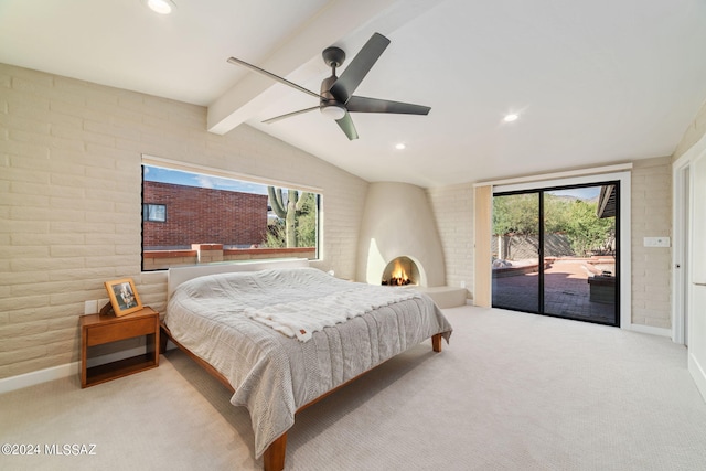 carpeted bedroom with ceiling fan, lofted ceiling with beams, access to exterior, and brick wall