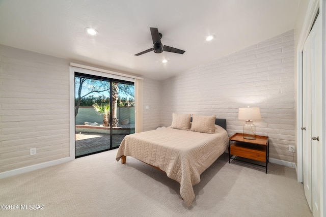 bedroom featuring ceiling fan, light colored carpet, vaulted ceiling, and access to exterior