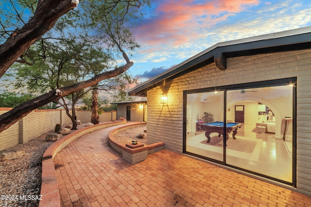 view of patio terrace at dusk