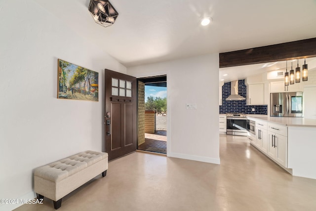 foyer with beam ceiling