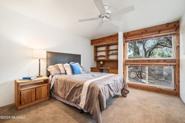 bedroom with ceiling fan and carpet floors