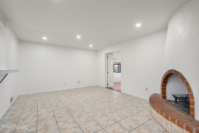 tiled living room with a fireplace