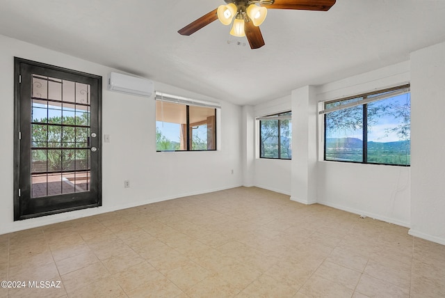 unfurnished room featuring ceiling fan, a wall unit AC, and vaulted ceiling