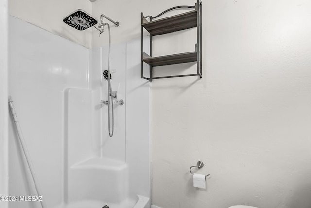 bathroom featuring walk in shower