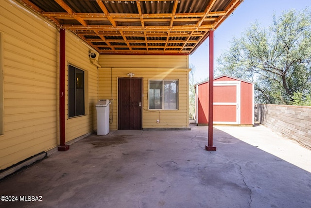 view of patio / terrace featuring a storage unit