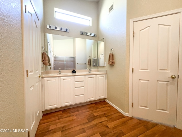 bathroom featuring hardwood / wood-style flooring and vanity