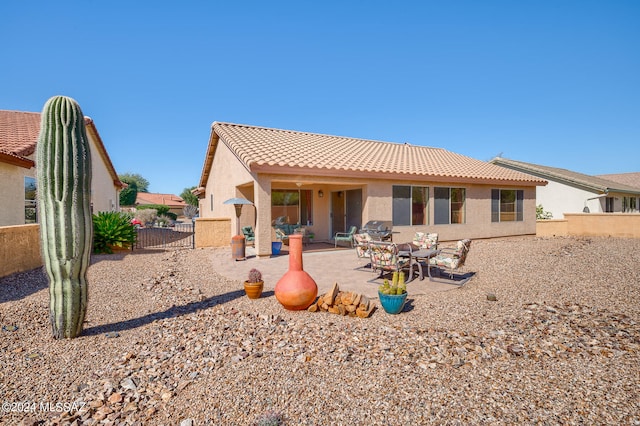 rear view of property with a patio area