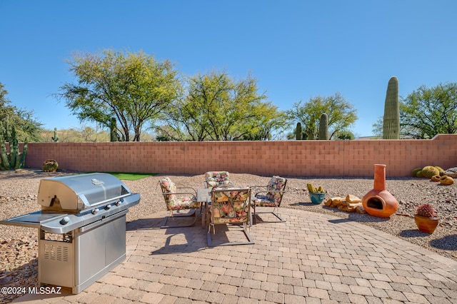 view of patio with a grill