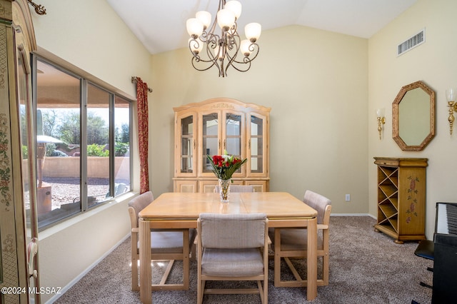 carpeted dining space with a notable chandelier and lofted ceiling