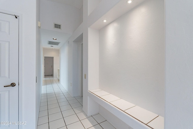 corridor with light tile patterned floors