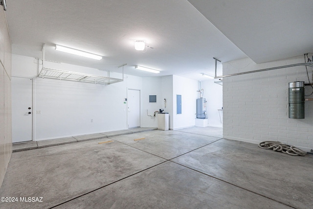 garage with electric panel and water heater