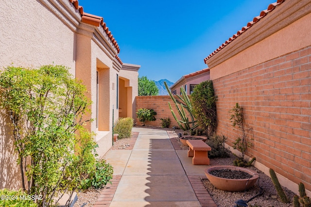 view of patio / terrace featuring a mountain view