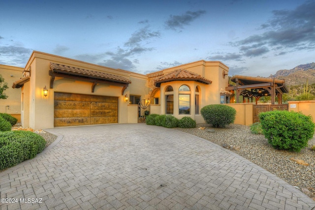 view of front of home featuring a garage and a mountain view