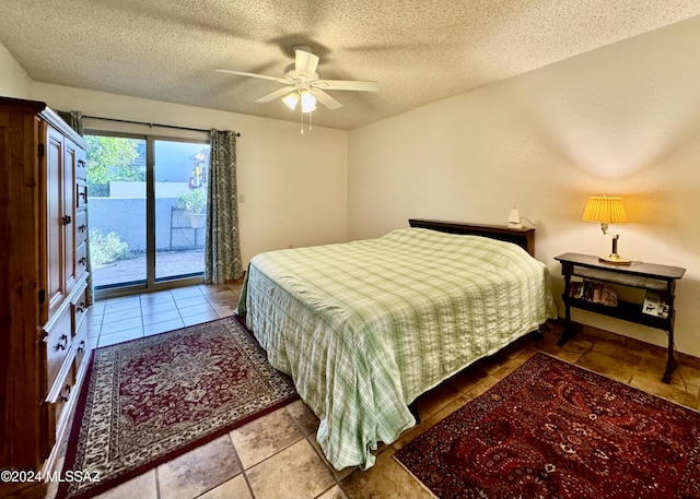 bedroom featuring light tile patterned floors, a textured ceiling, access to outside, and ceiling fan