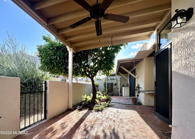 view of patio featuring ceiling fan