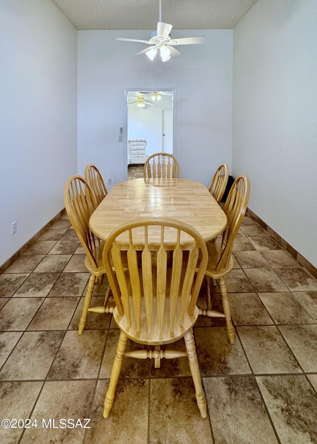 dining room with ceiling fan and a textured ceiling