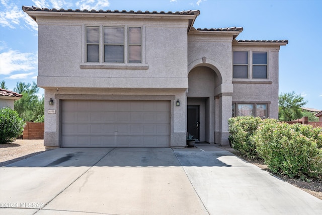 mediterranean / spanish-style home featuring a garage