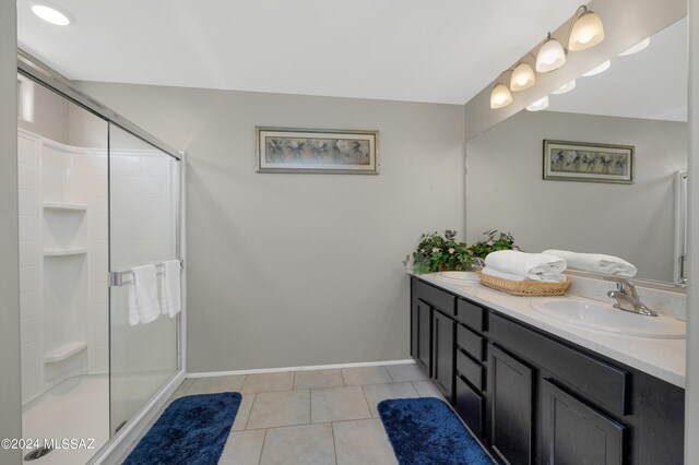 6524 S Diablo Dr, Tucson, AZ 85757 - full bath featuring a stall shower, vanity, baseboards, and tile patterned floors
