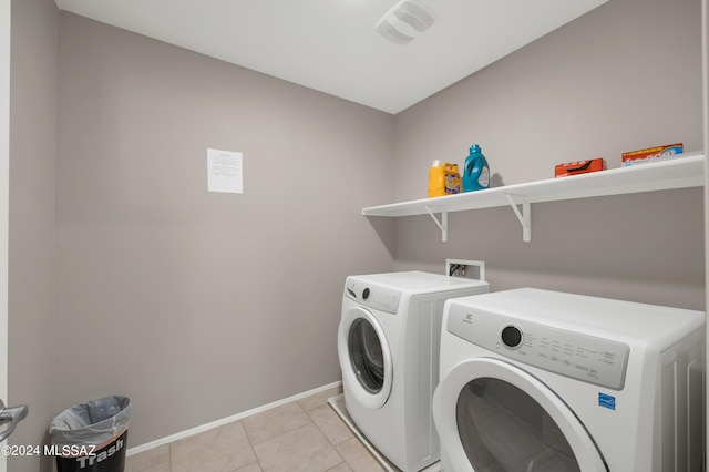 6524 S Diablo Dr, Tucson, AZ 85757 - clothes washing area featuring washing machine and clothes dryer, light tile patterned floors, visible vents, laundry area, and baseboards