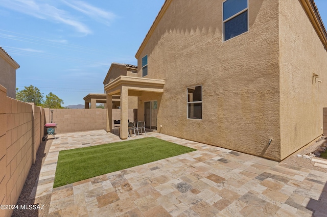 6524 S Diablo Dr, Tucson, AZ 85757 - rear view of property with a patio, a fenced backyard, and stucco siding