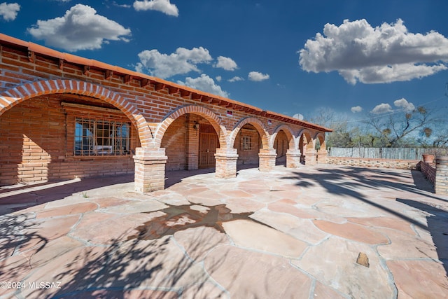 view of patio / terrace featuring fence