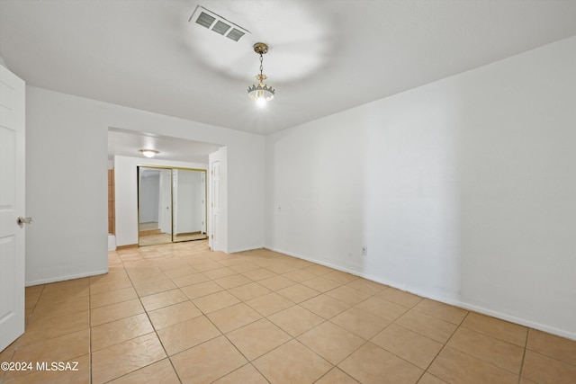 empty room with light tile patterned floors