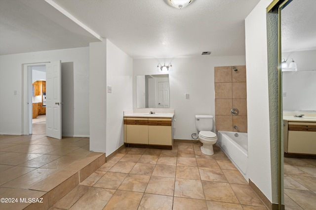 bathroom featuring vanity, baseboards, a textured ceiling, toilet, and visible vents