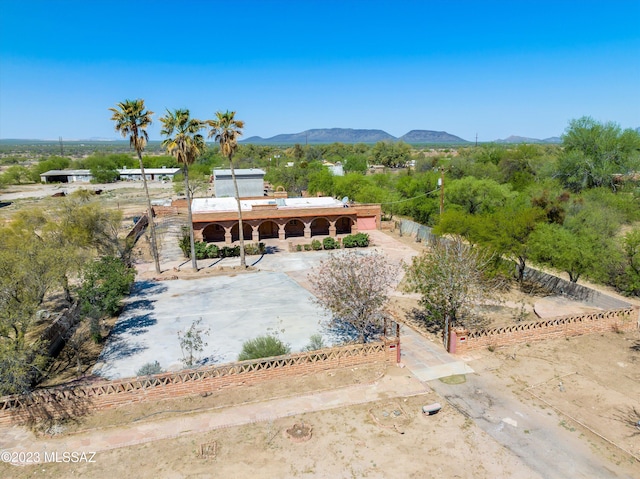 birds eye view of property with a mountain view