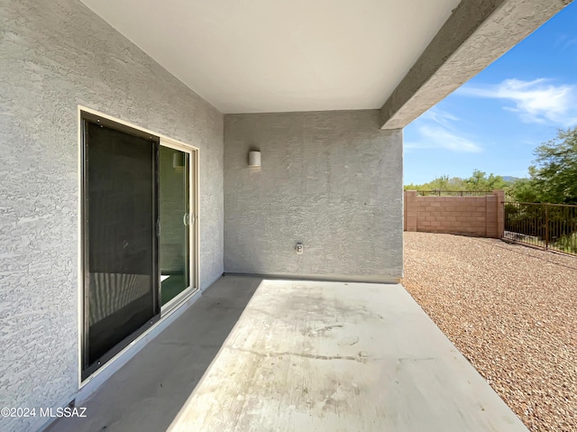 view of patio / terrace featuring fence