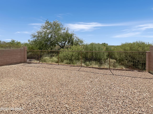 view of community featuring fence