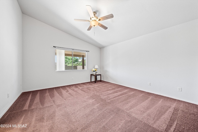 unfurnished room with carpet, vaulted ceiling, and ceiling fan