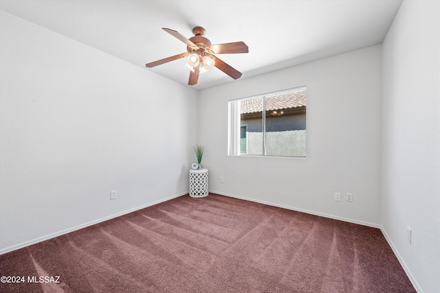 spare room featuring carpet flooring and ceiling fan