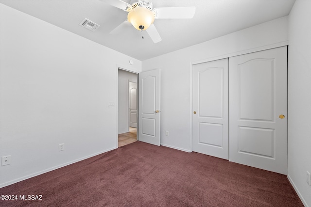 unfurnished bedroom with a closet, ceiling fan, and light colored carpet