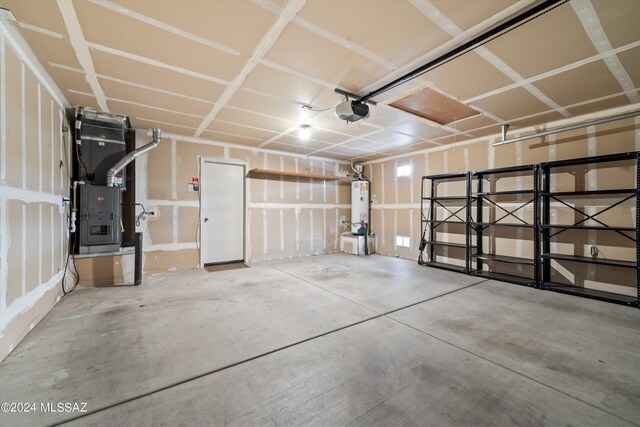 garage with water heater and a garage door opener