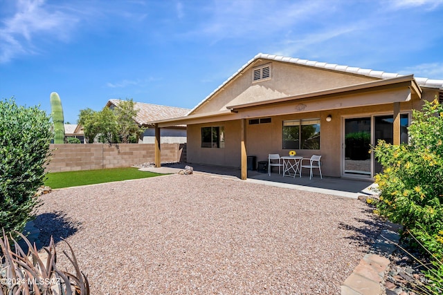 back of property featuring a patio area