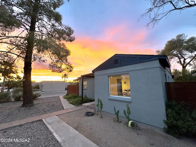 view of property exterior at dusk