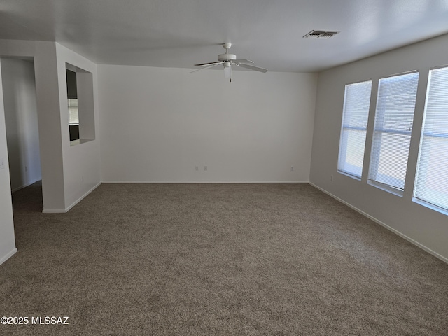 unfurnished room with carpet flooring and ceiling fan