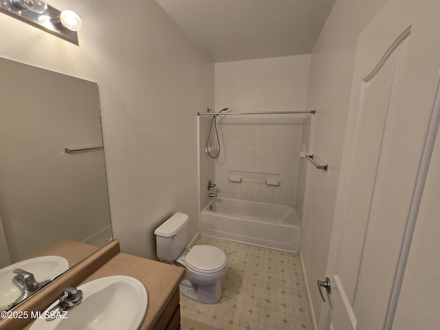 full bathroom featuring tiled shower / bath, vanity, and toilet