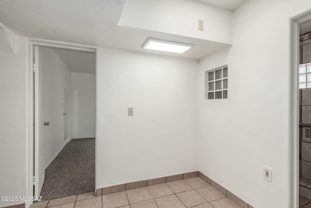 spare room with light tile patterned floors